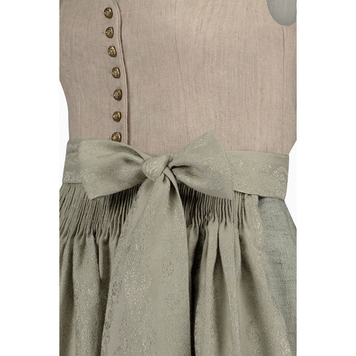 Traditional Bavarian dirndl with a beige bodice and green skirt on a white background