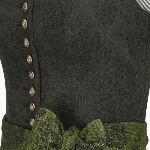 Close-up of a dark green fabric with gold buttons and green trim
