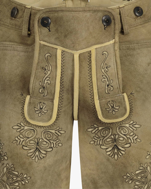 Brown leather pants with intricate embroidery on a white background