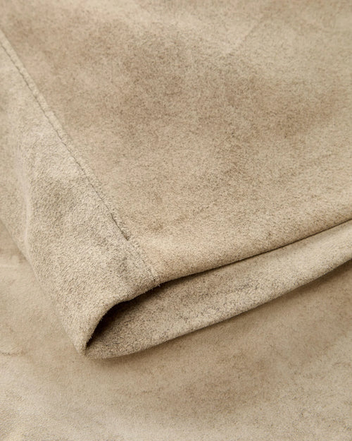 Close-up of beige fabric with a soft texture