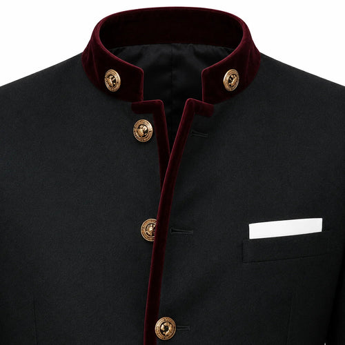 A close-up of a black traditional jacket with a contrasting deep red velvet collar and front trim, accented by gold-tone decorative buttons and a white pocket square.
