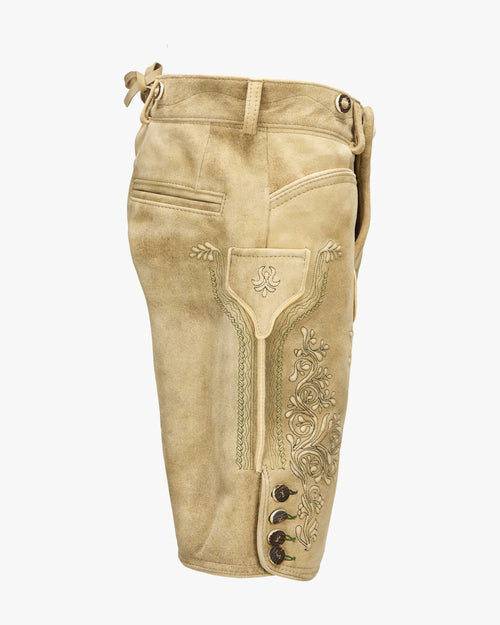 Beige leather riding pants with decorative stitching on a white background