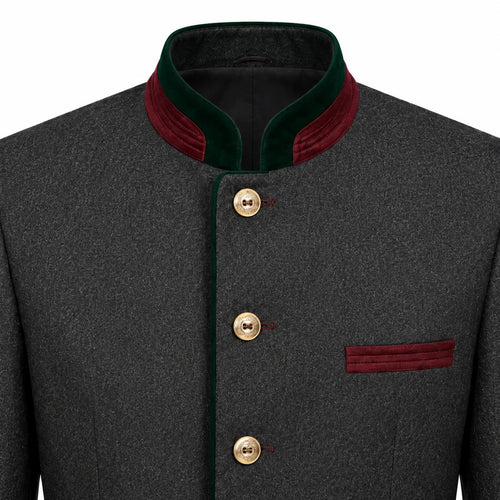 A close-up of a dark gray textured jacket with a mandarin collar, featuring dark green velvet trim, gold buttons, and a matching dark green pocket flap on a white background.