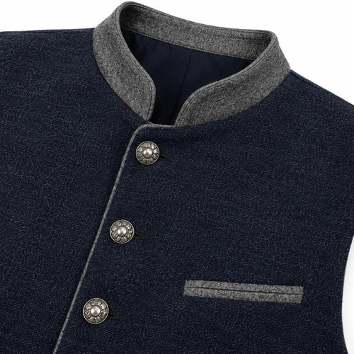 Close-up of a dark navy textured jacket with a gray mandarin collar, gray piping, and decorative silver buttons.
