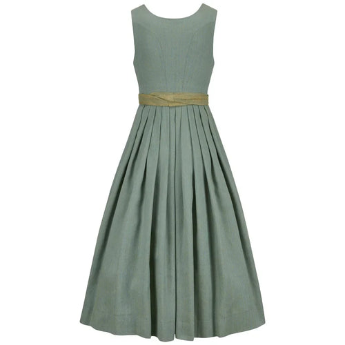 Green dress with a gold belt on a white background