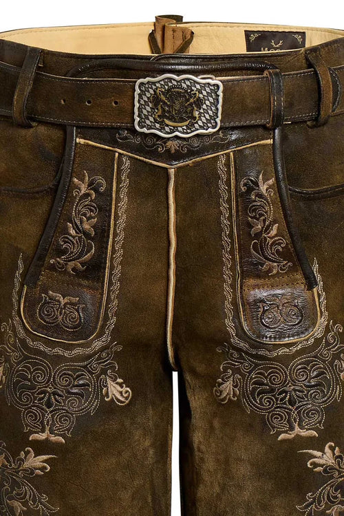 Brown leather pants with intricate embroidery and a decorative belt buckle.