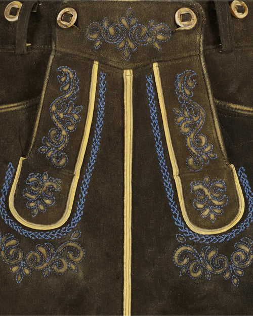 Brown leather pants with blue and gold embroidery and grommets.